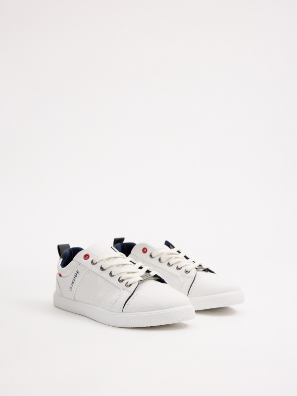 White canvas sneakers white 45º front view