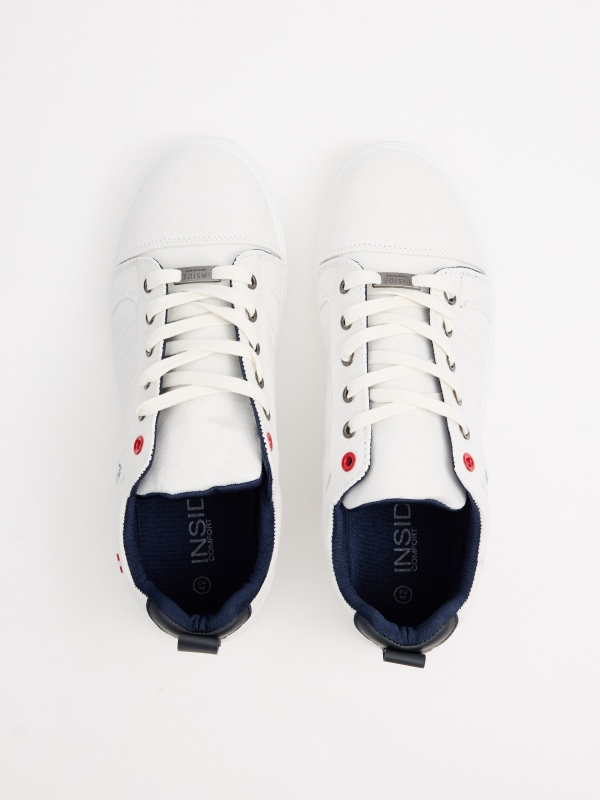 White canvas sneakers white zenithal view