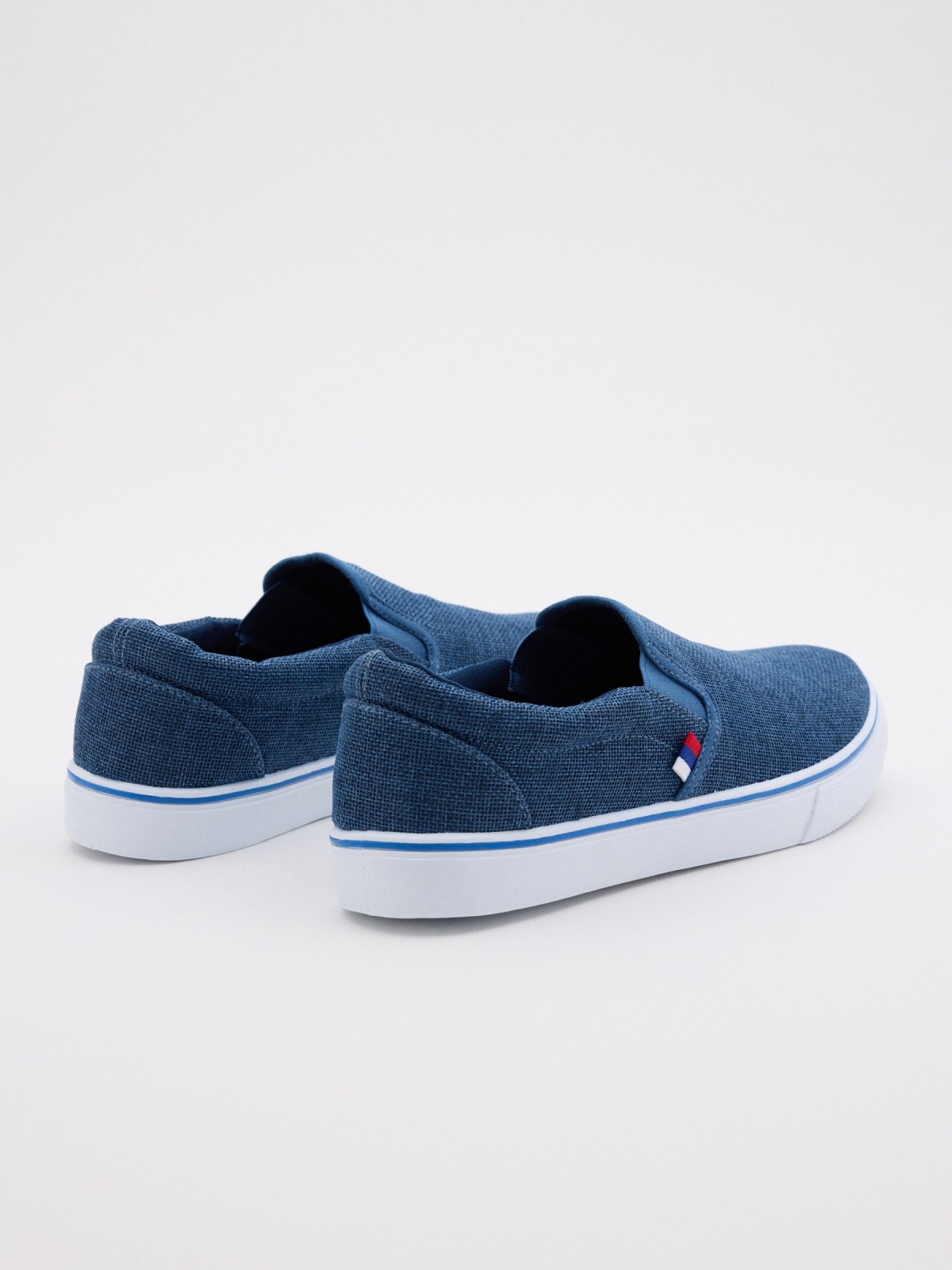 Blue canvas slip-on sneaker indigo blue 45º back view