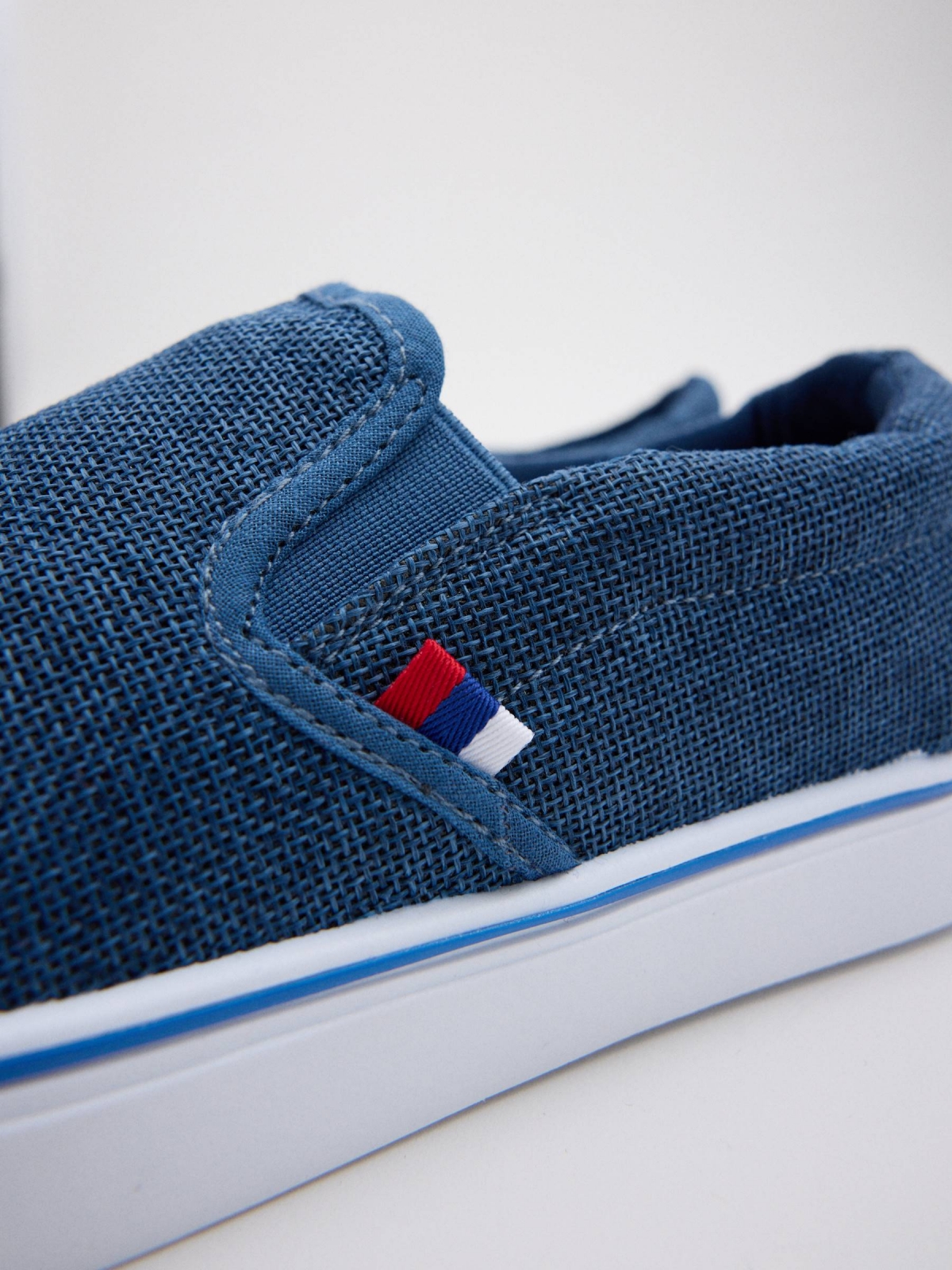 Blue canvas slip-on sneaker indigo blue detail view