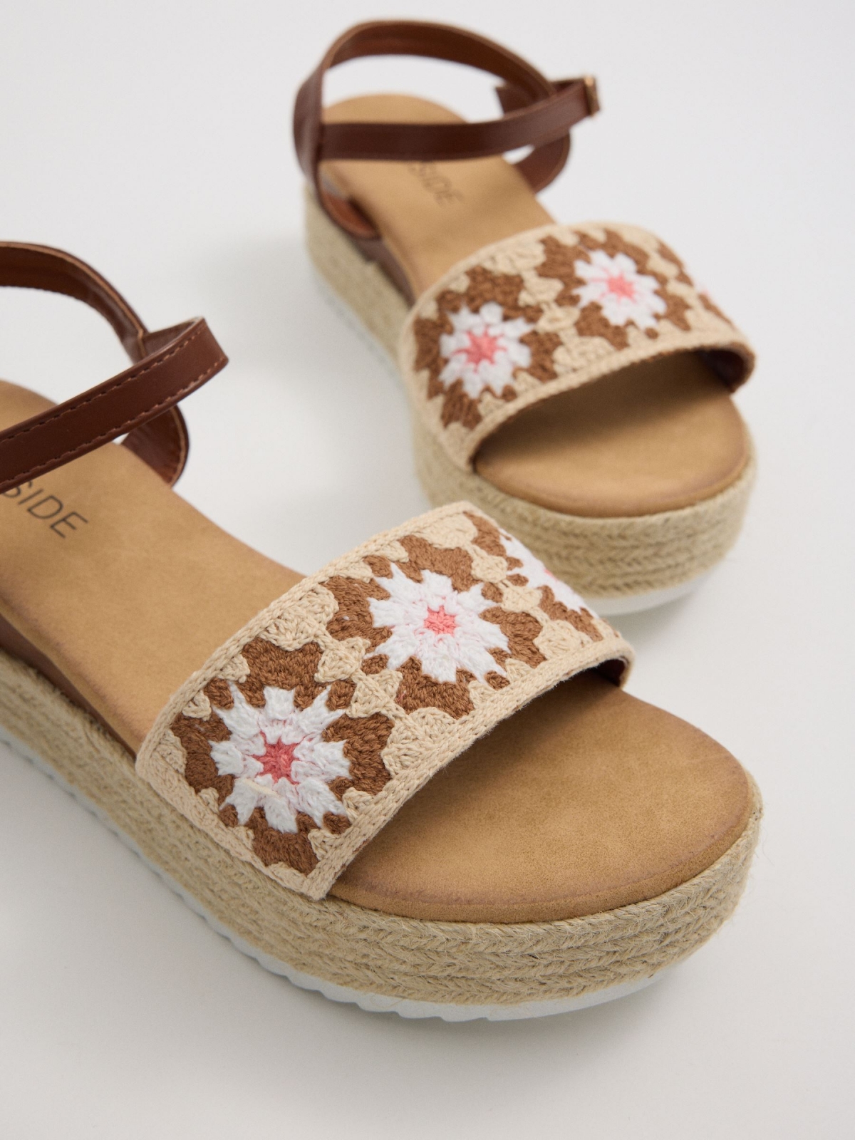 Crochet wedge sandals flowers sand detail view