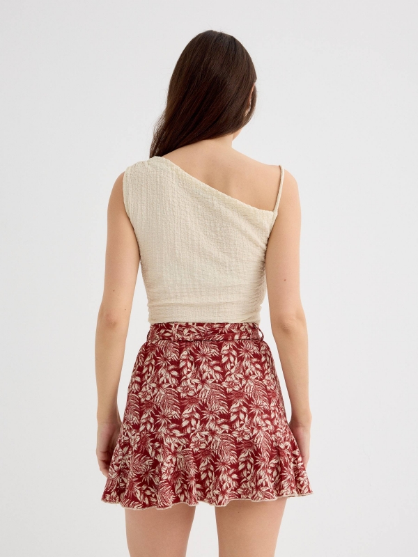 Asymmetric top with textured relief sand middle back view