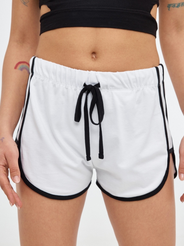 Short contrasting trims white front detail view