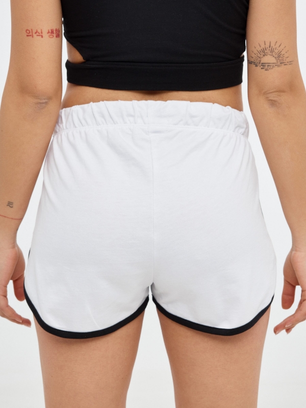 Short contrasting trims white back detail view