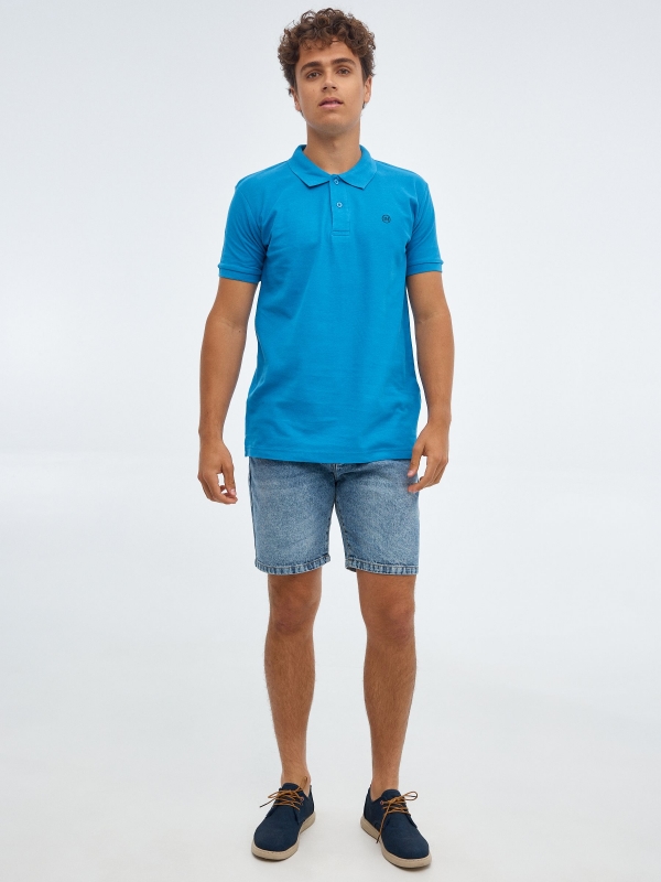 Basic polo shirt with engraved logo sky blue front view