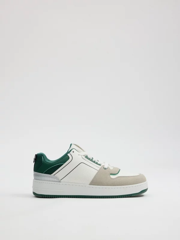 Tênis de skatista verde e branco verde vista perfil