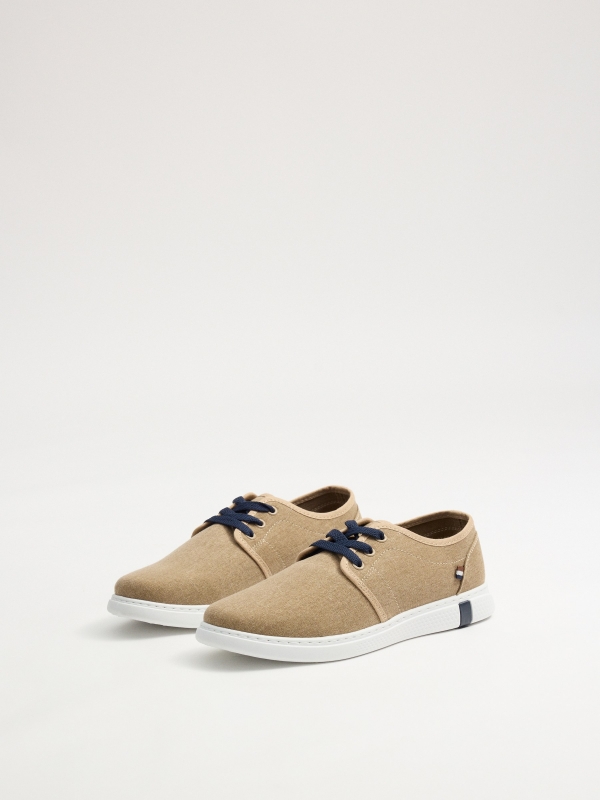 Light brown canvas sneakers light brown 45º front view