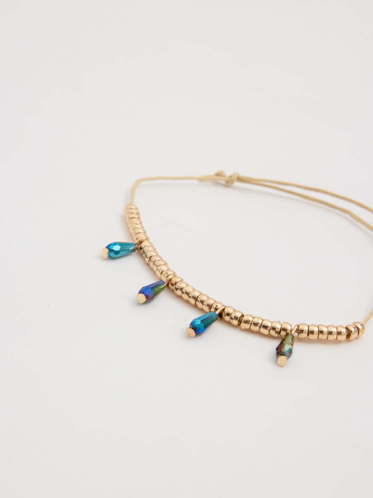 Set cuatro pulseras multicolor vista detalle