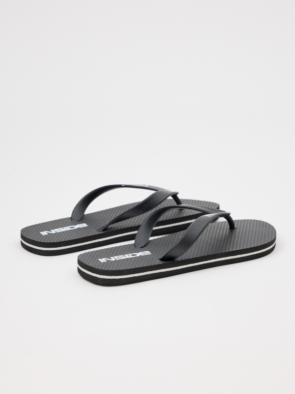 Black flip-flops black 45º back view