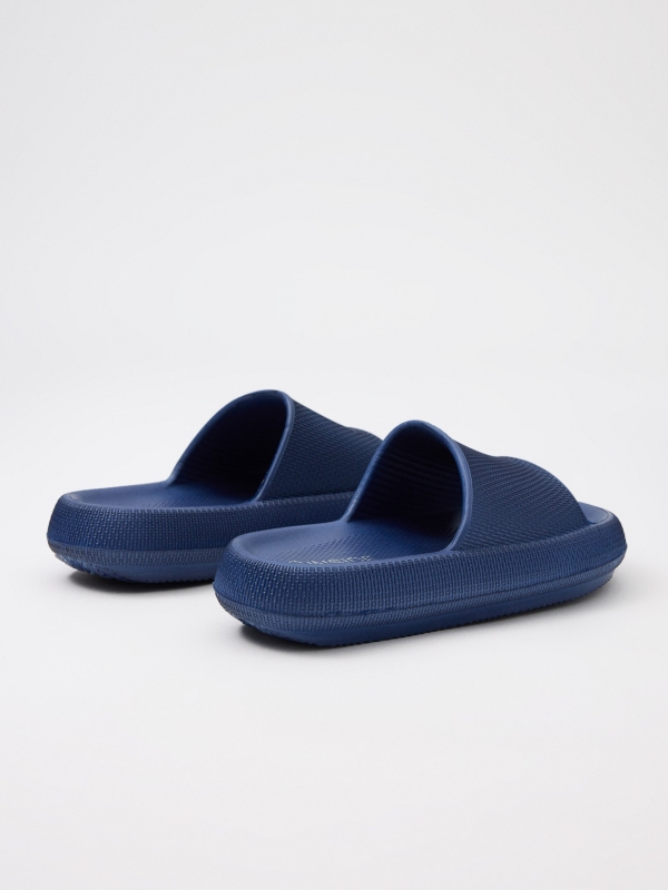Blue flip-flops navy 45º back view