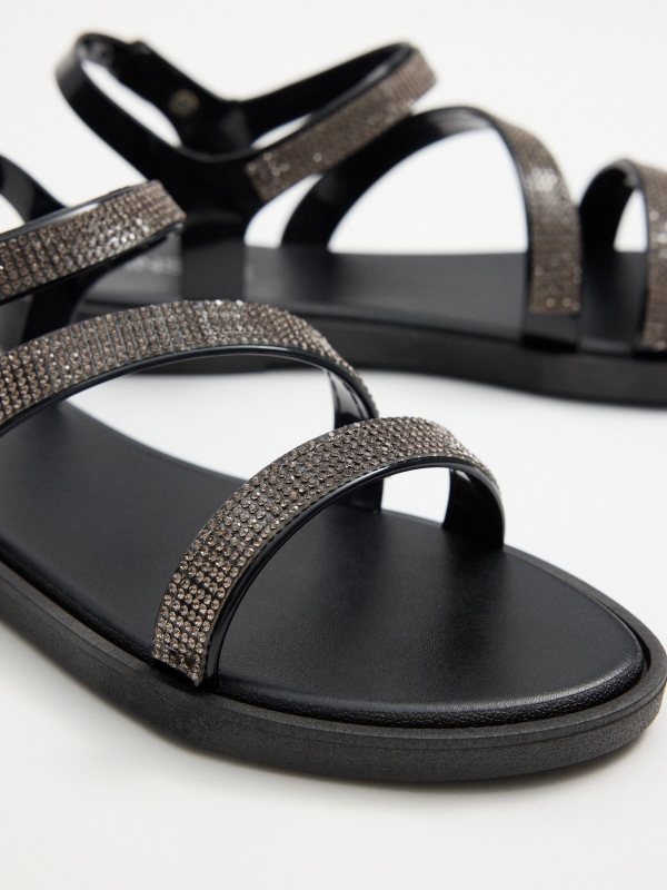 Black shiny strap sandal black with a model