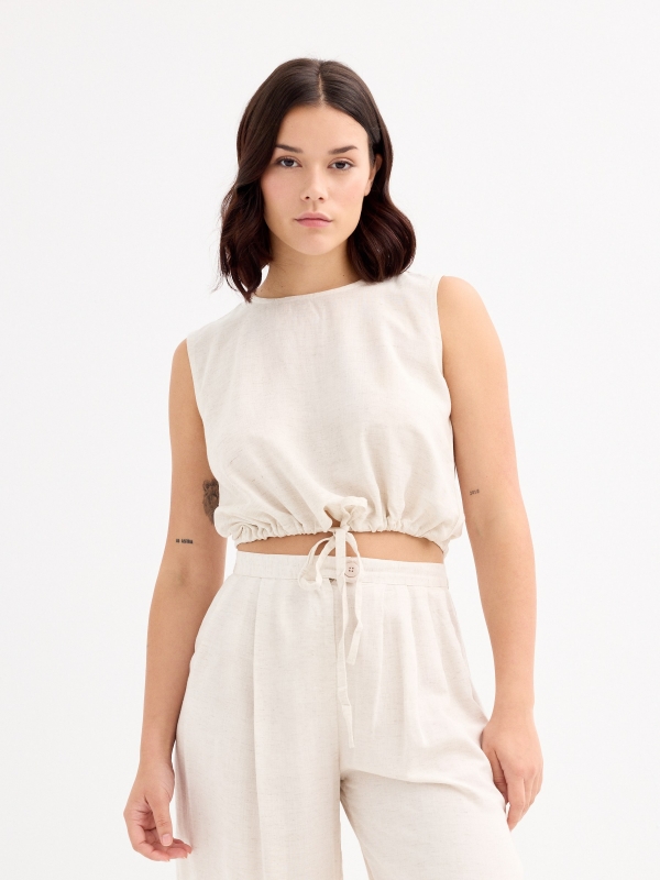 Sleeveless sand blouse beige middle front view