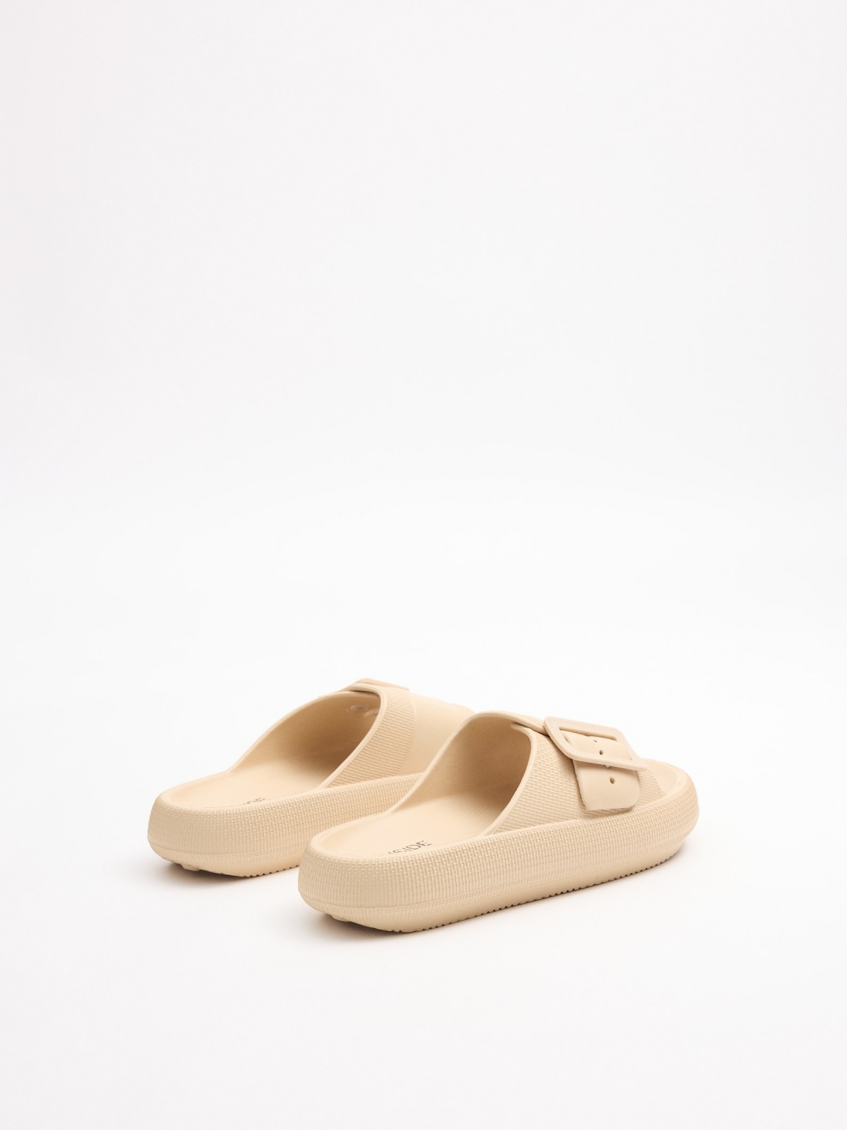 White platform sandal buckle sand 45º back view