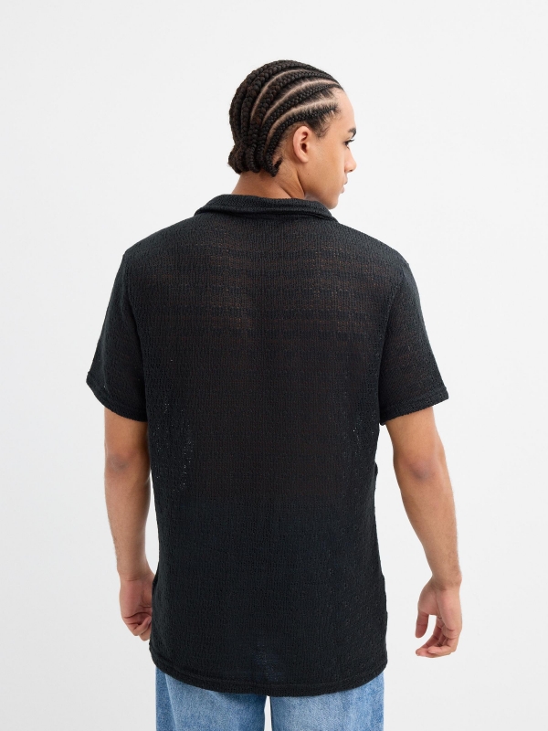Black short sleeve knit shirt black middle back view