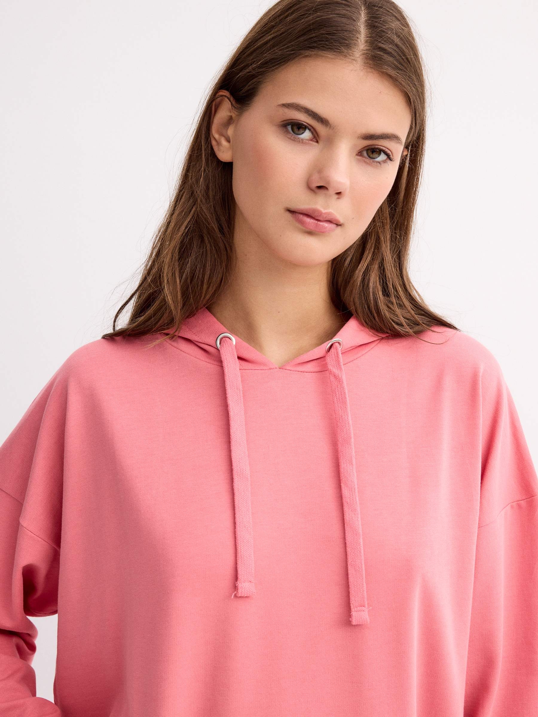 Sudadera canguro básica rosa claro vista media frontal