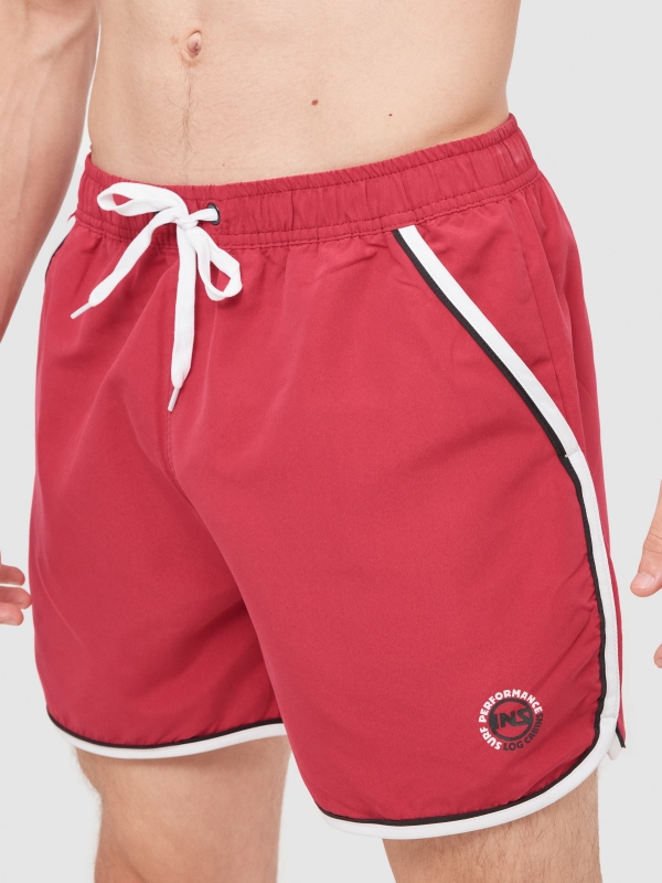 Swimsuit contrast trim red detail view