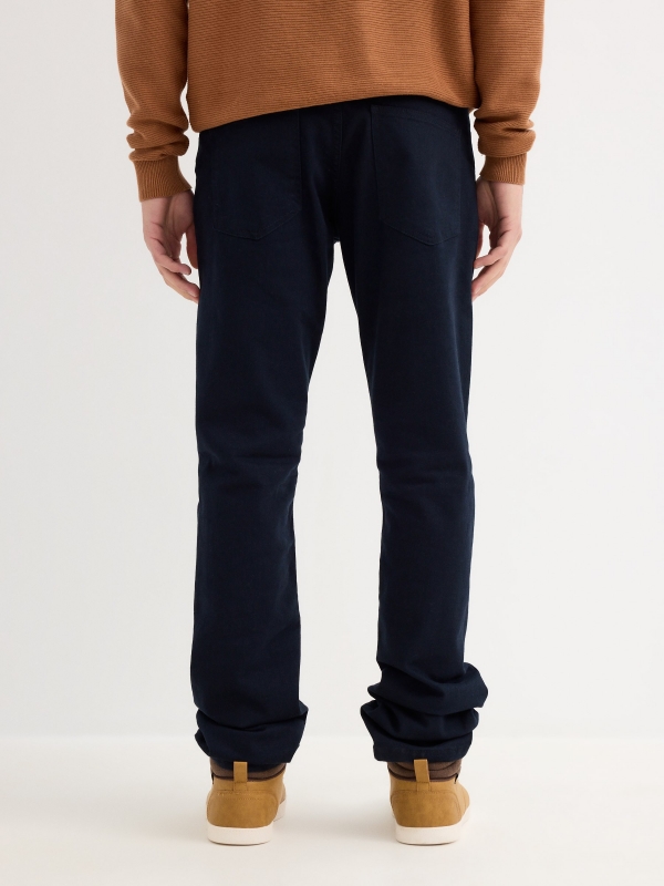 Basic colored jeans blue middle back view