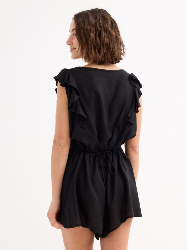Short jumpsuit with buttons black middle back view