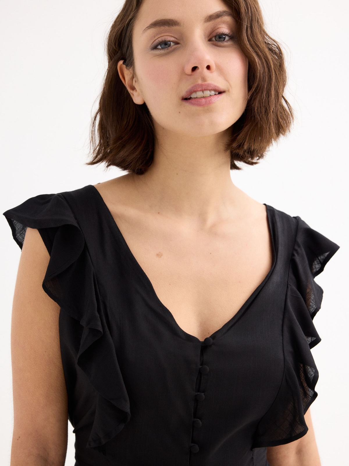 Short jumpsuit with buttons black detail view