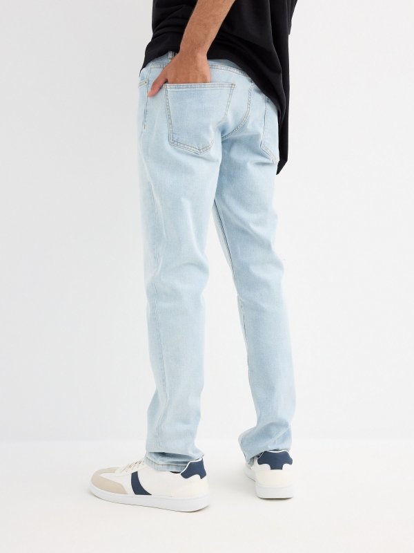 Light blue regular jeans with stitching blue middle back view