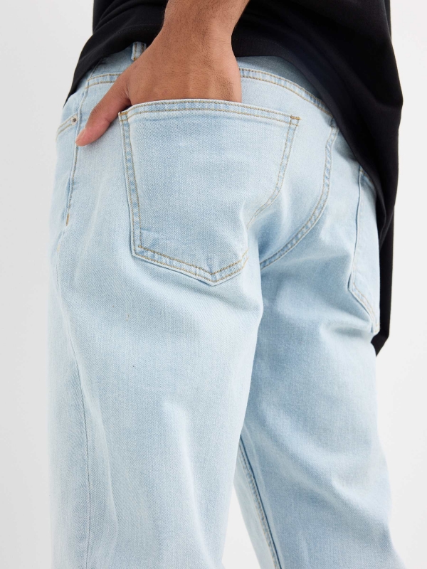 Light blue regular jeans with stitching blue detail view