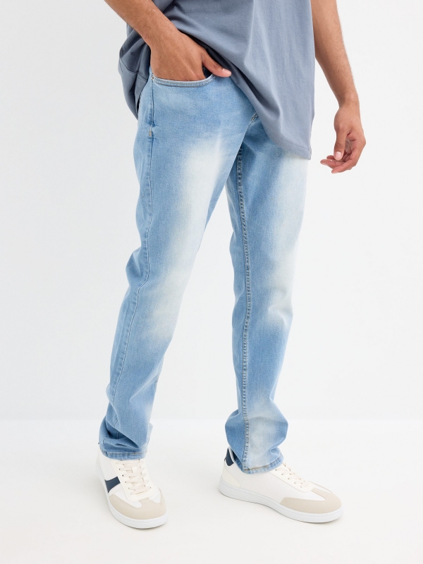 Light blue slim jeans with a worn effect blue middle front view