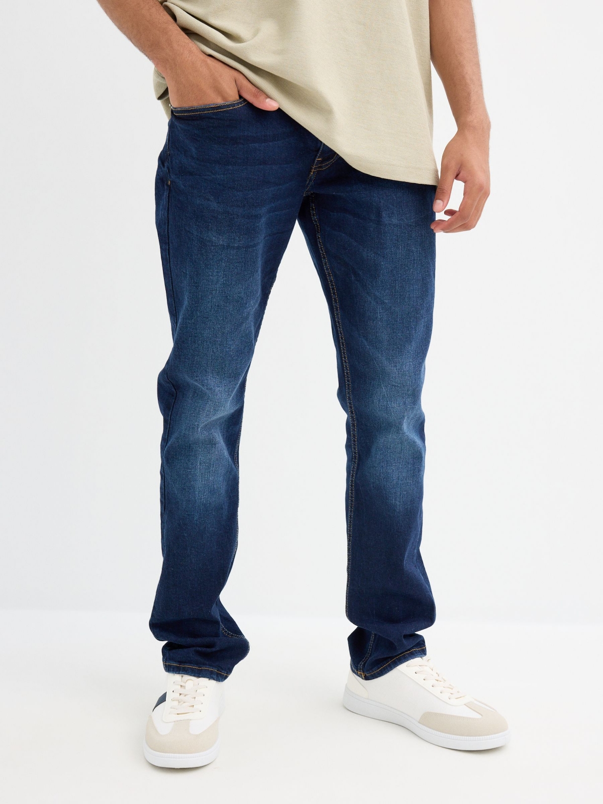 Dark blue slim jeans with stitching blue middle front view