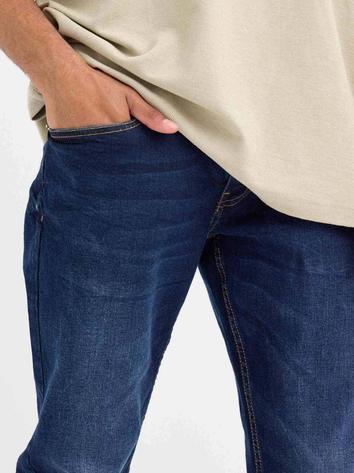 Dark blue slim jeans with stitching blue detail view