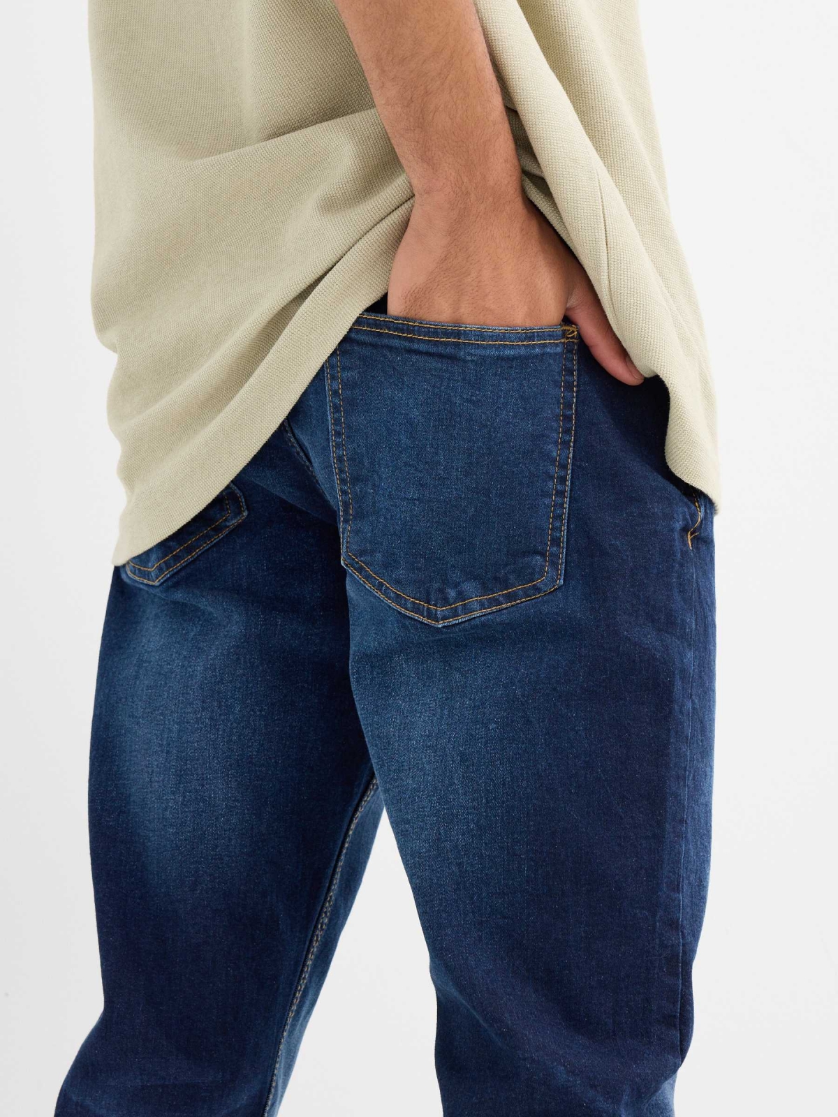 Dark blue slim jeans with stitching blue detail view