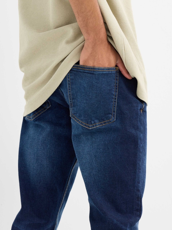 Dark blue slim jeans with stitching blue detail view