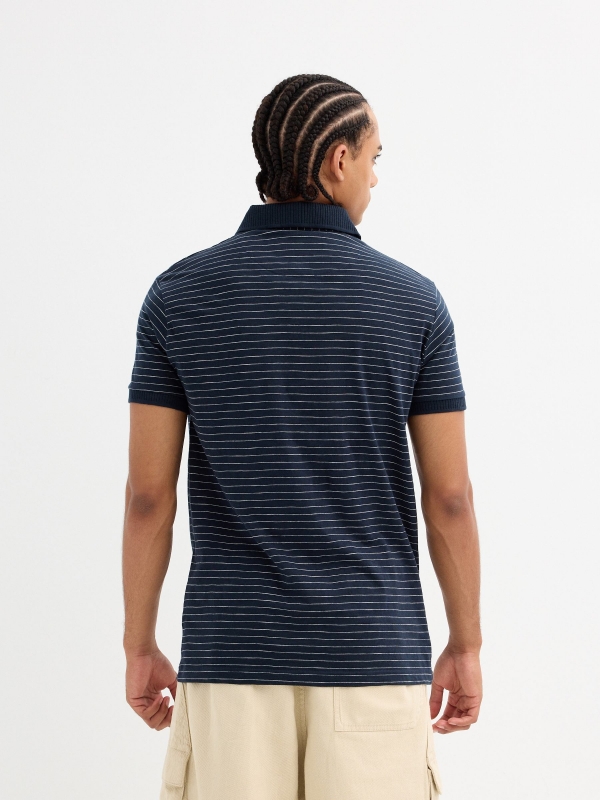 Striped polo navy middle back view