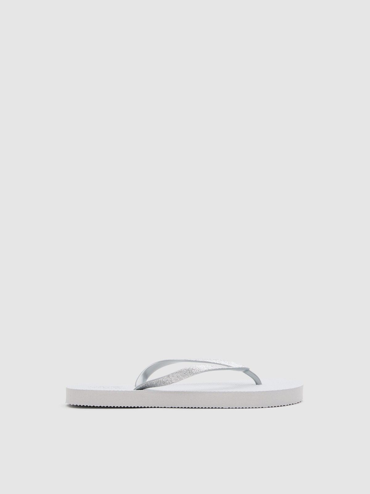 Chanclas dedo blanco blanco vista lateral