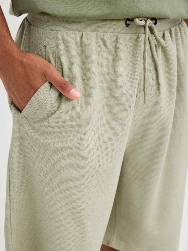 Plain sports Bermuda shorts greyish green detail view