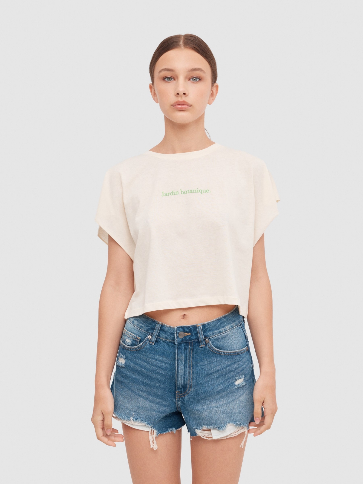 Camiseta cropped sem mangas Jardim Botânico off white vista meia frontal