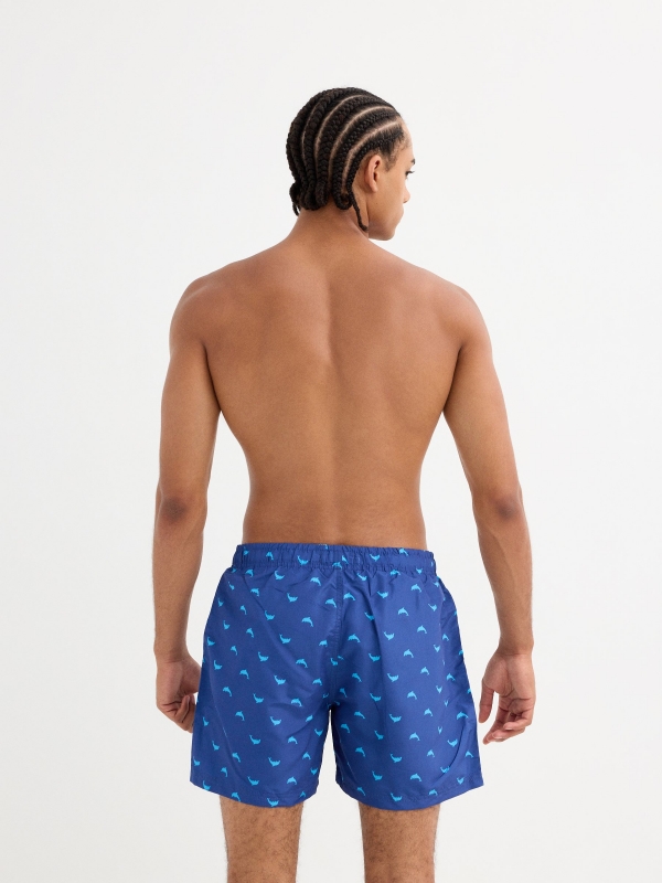 Dolphin print swimsuit blue middle back view