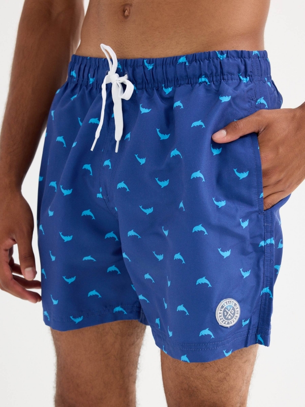 Dolphin print swimsuit blue detail view