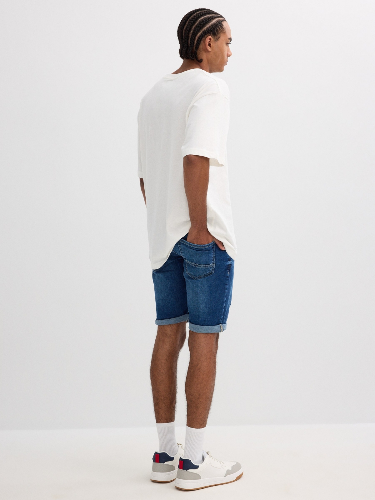 Ripped distressed denim bermuda short blue middle back view