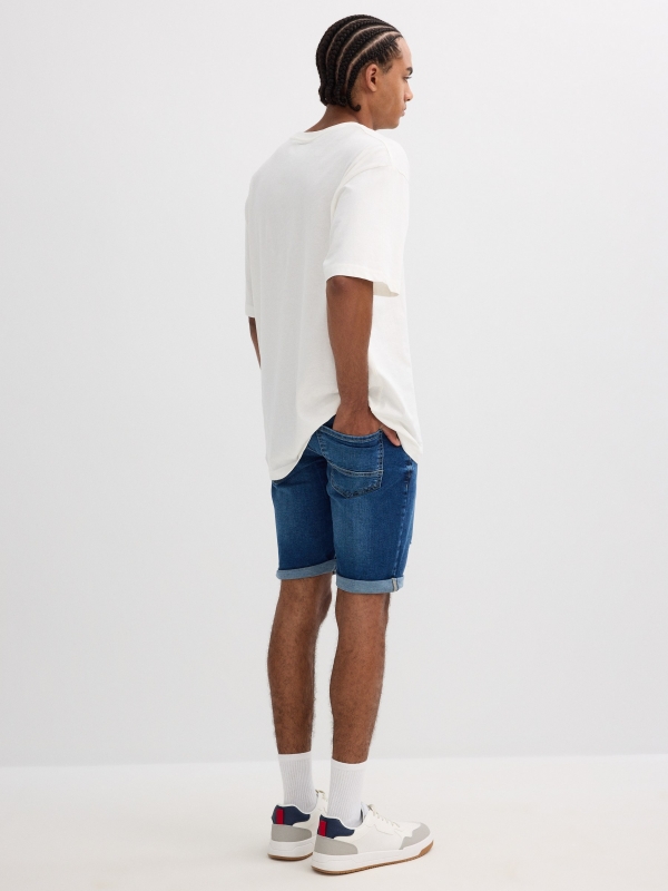 Ripped distressed denim bermuda short blue middle back view