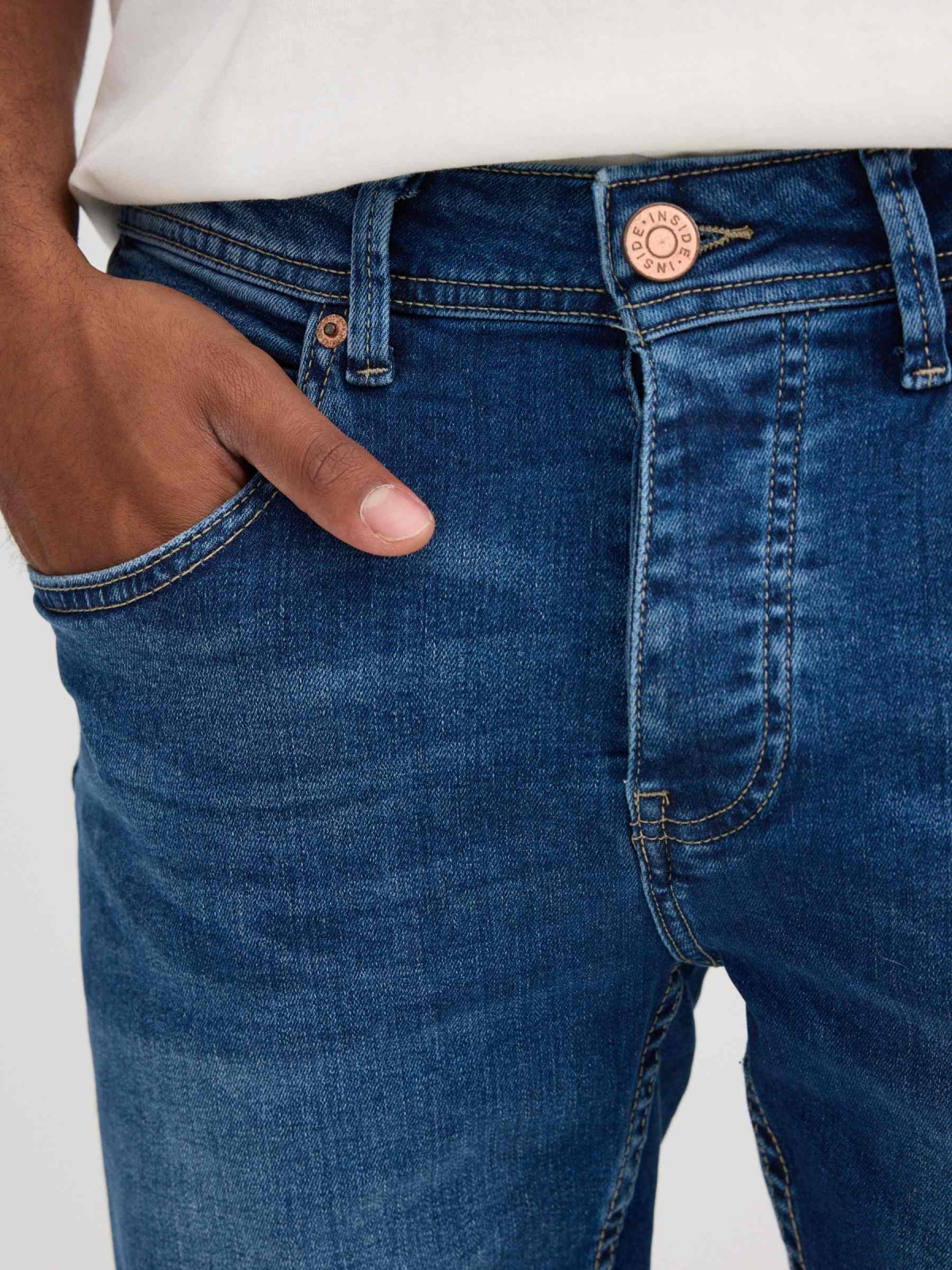Ripped distressed denim bermuda short blue detail view