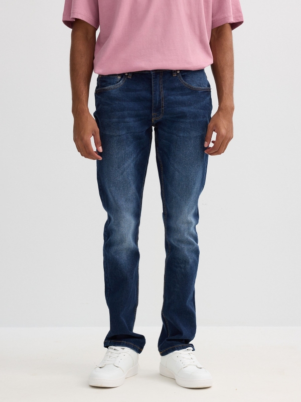 Jeans slim azul oscuro costuras azul vista media trasera