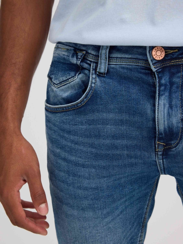 Distressed blue denim bermuda blue detail view