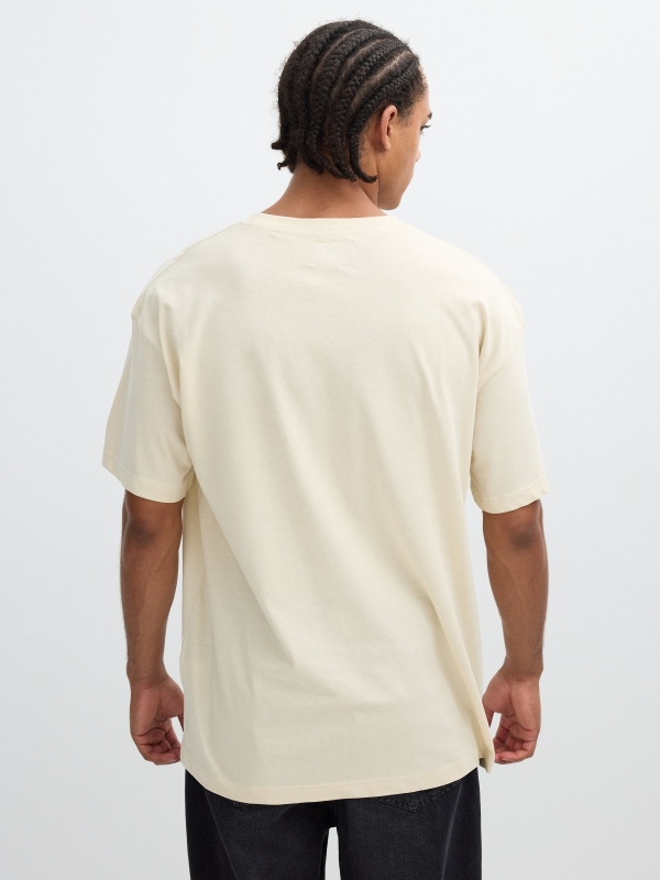 Camiseta estampa texto Inside areia vista meia traseira