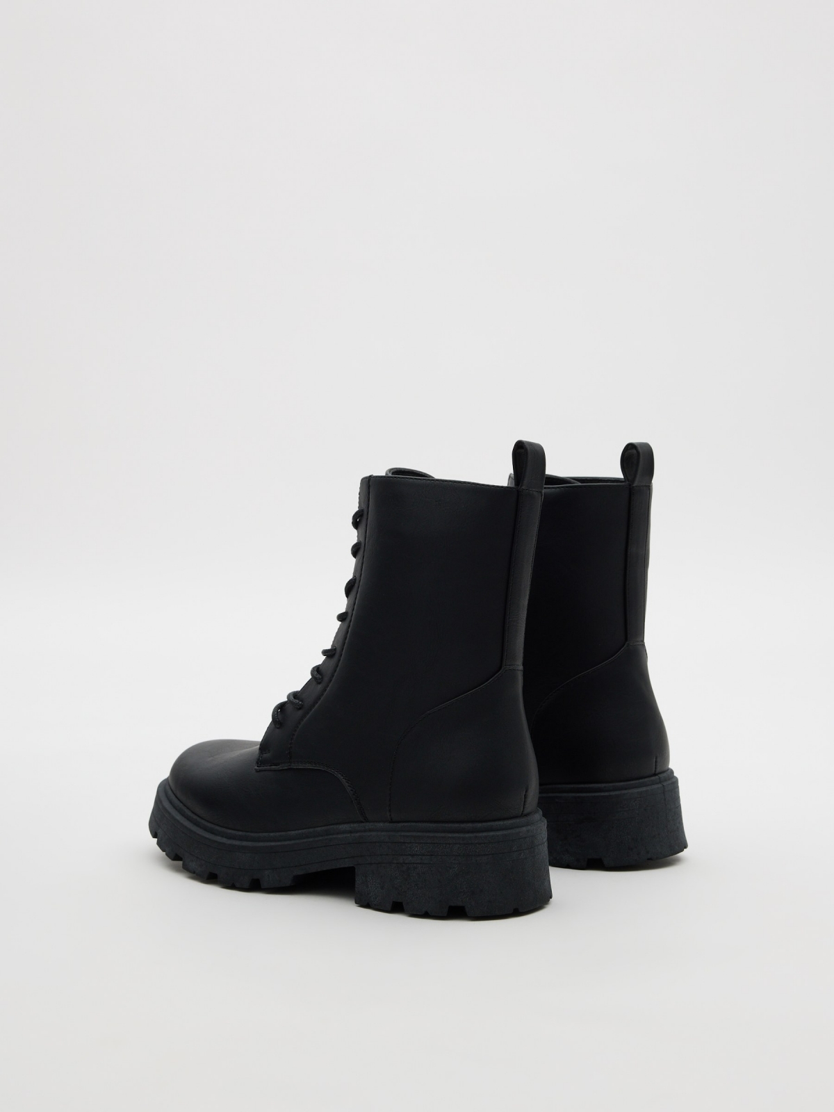Lace-up track sole boot black 45º back view