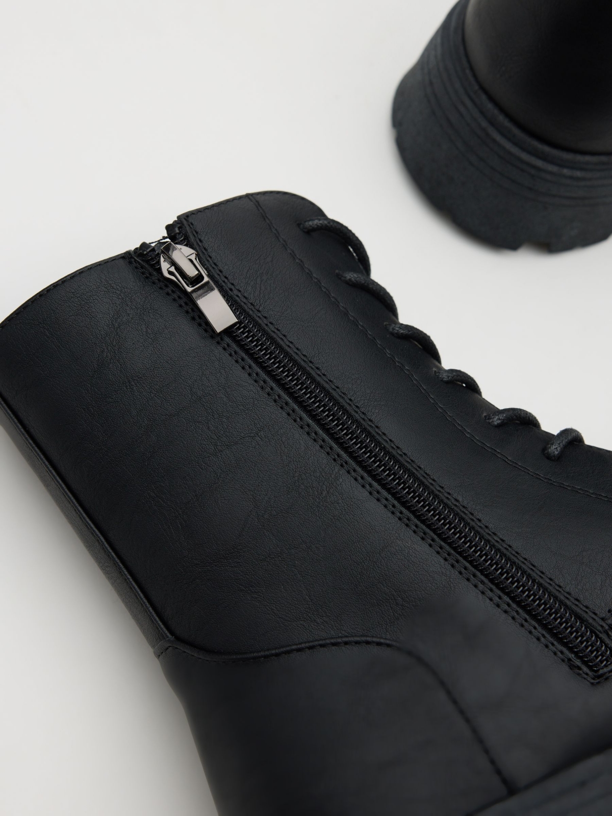 Lace-up track sole boot black detail view