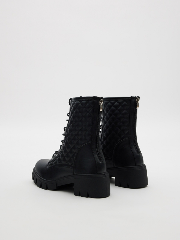 Quilter lace-up boot black 45º back view