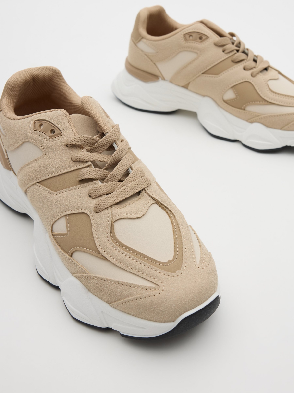 Running shoes arena sand detail view