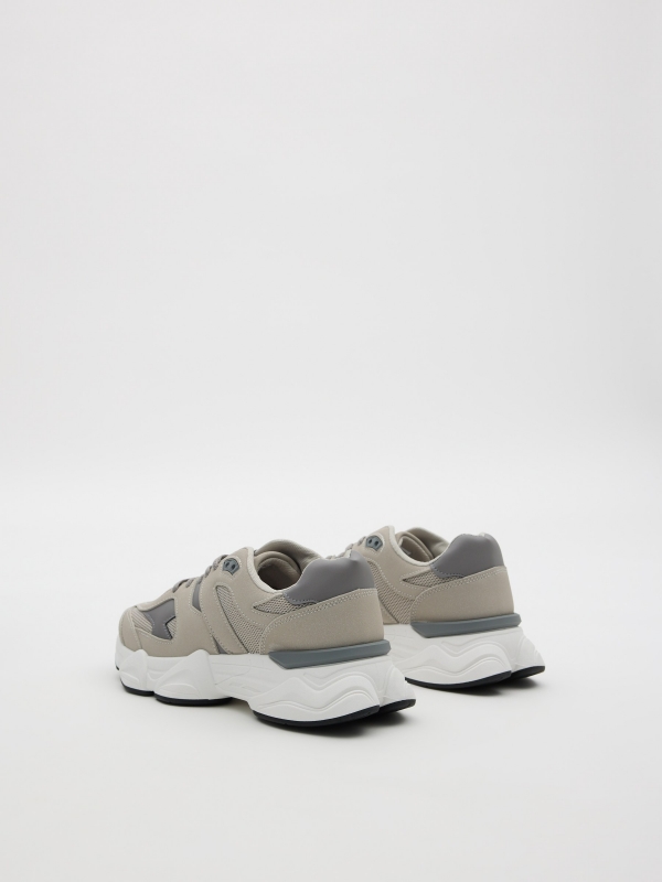 Zapatillas running gris gris medio vista trasera 45º