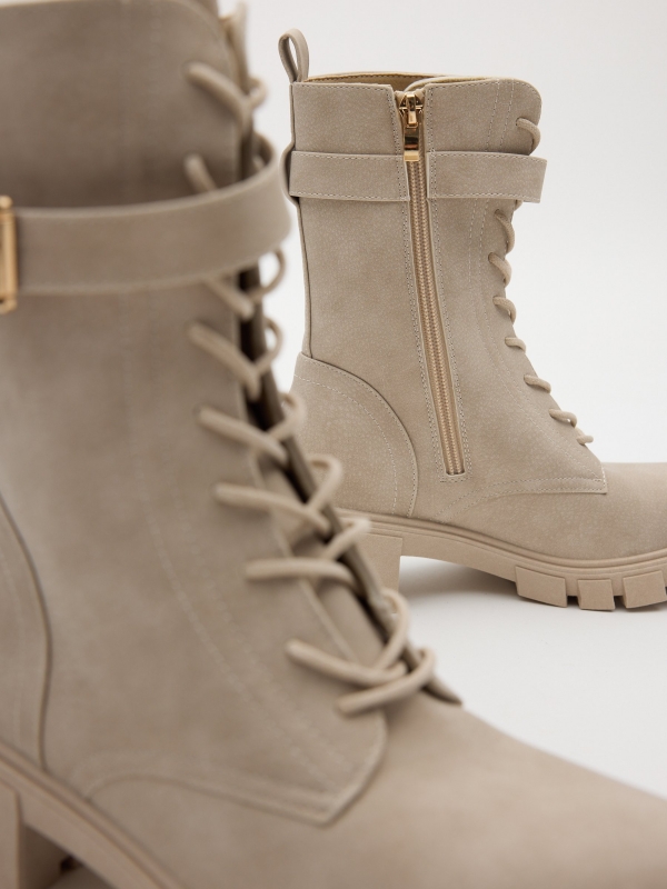 Lace-up boots with buckle raw detail view
