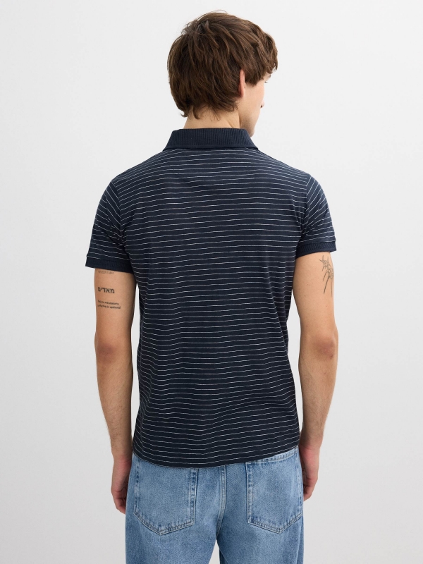 Striped polo navy middle back view
