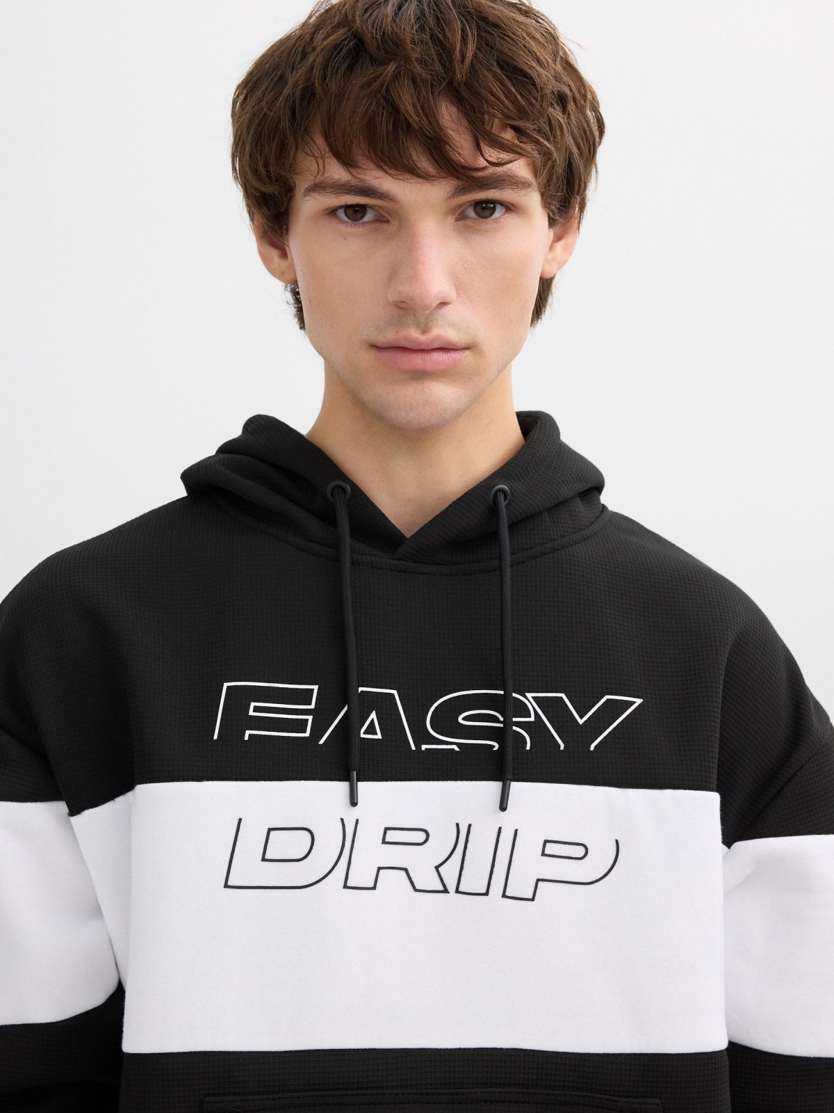 White and black color block hoodie black detail view